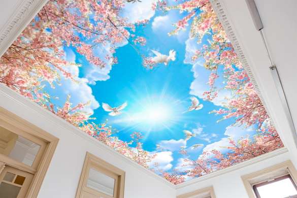 Фотообои с видом на голубое небо и розовые цветы.