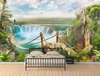 Wall Mural - Wooden bridge along a landscape with a waterfall and hills