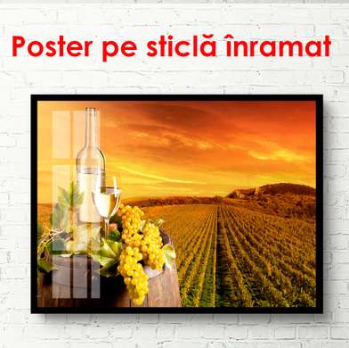Poster - A bottle of wine with grapes in the background of a vineyard at sunset, 90 x 60 см, Framed poster, Food and Drinks