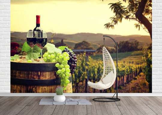 Wall Mural - A bottle of wine on the background of a grape field.