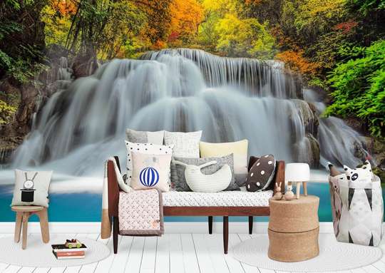 Wall Mural - Cascade on the background of trees with yellowish leaves