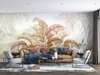 Wall mural - Leaves in warm shades on a beige background