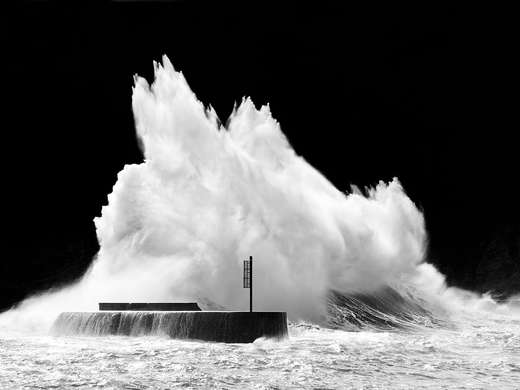 Poster - Big wave hits the rock, 45 x 30 см, Canvas on frame, Black & White