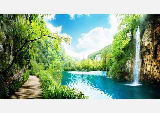 Wall Mural - Small waterfall and trees against the sky