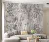 Wall mural - Spring leaves and birds in shades of gray pink