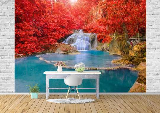 Wall Mural - Cascade on the background of plants with red leaves