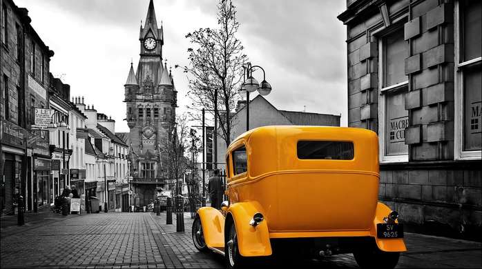 Wall Mural - Yellow car in a black and white city