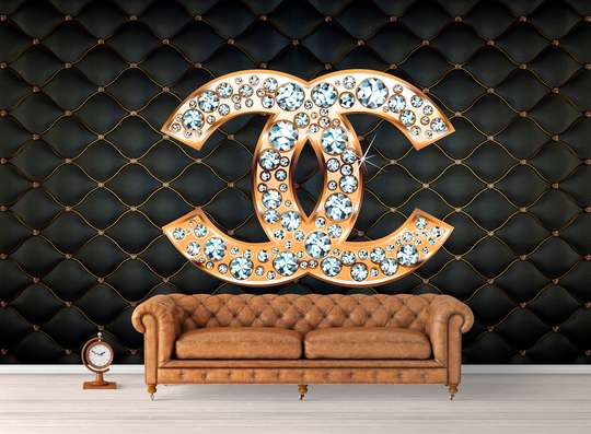 Wall Mural - Chanel sign with stones on a dark background