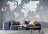 Wall mural - World map with mountains and stars in pale blue color