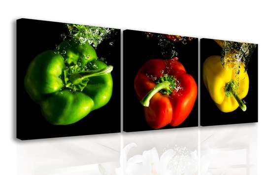 Modular picture, Multi-colored peppers in water on a black background