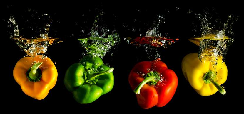 Modular picture, Multi-colored peppers in water on a black background