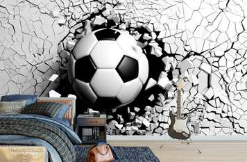 Wall Mural - Soccer ball through the wall