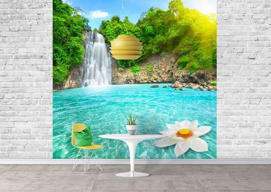 Wall Mural - Waterfall in which a white flower floats against the backdrop of a forest