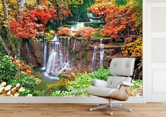 Wall Mural - Waterfall on the background of trees with colorful leaves