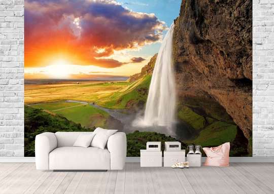 Wall Mural - Waterfall in the mountains against the backdrop of a beautiful sunrise