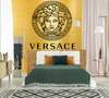 Wall Mural - Versace logo on a golden wall