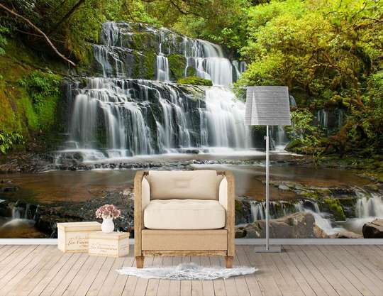 Wall Mural - Charming cascade and large stones on the background of trees