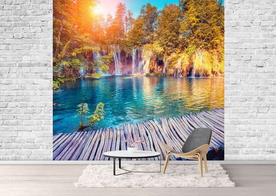 Wall Mural - Bridge against the backdrop of a cascade, forest and clear sky